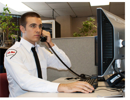 Life Alert ® Dispatcher speaking with a customer during a medical emergency.